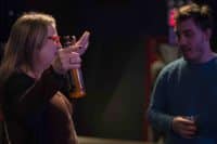 Two member of the audience enjoying the Brooklyn Brewery craft beers.